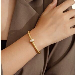 Elegant gold tone cable twisted cuff bangle  Bracelet